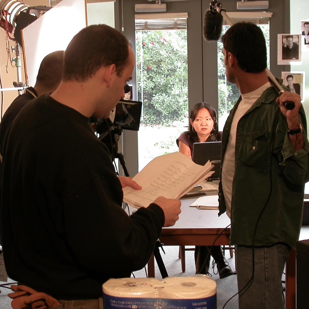 Director Carl Strecker and boom operator Enrique Rivero, and actress Sara Hyoun prepare to shoot as scene of Take 24 Director Carl Strecker and boom operator Enrique Rivero, and actress Sara Hyoun prepare to shoot as scene of Take 24