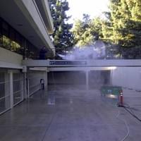 Commercial pressure washing a parking garage.