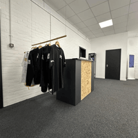 Dedicated member area featuring academy merchandise and reception facilities.