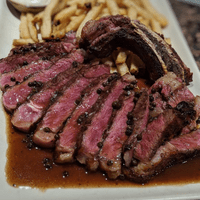 Grilled Ribeye, frites, green peppercorn demi glace