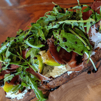 Fig, bufala riccota, arugula bruschetta