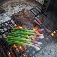 Grilled porterhouse and spring onions