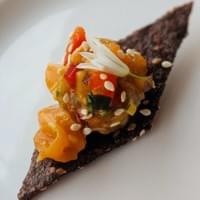 Salmon Poke, wild onion, black rice cracker