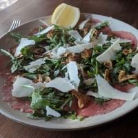 Beef Carpaccio, fried artichokes, arugula and Parmigiano