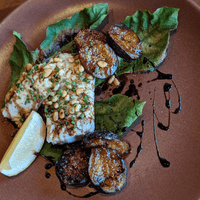 Fig leaf wrapped and grilled local halibut, figs and balsamico