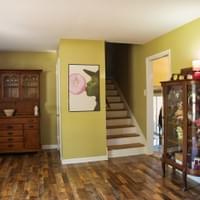 Beige room and staircase Beige room and staircase