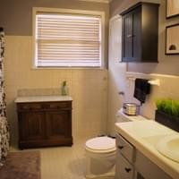 Full bathroom with wood vanity Full bathroom with wood vanity