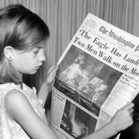 "This is a picture of my mother holding the Washington News Paper on Monday, July 21st 1969 stating 'The Eagle Has Landed Two Men Walk on the Moon'. The photo was taken by my grandfather Jack Weir (1928-2005)"
