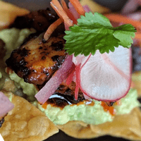 Grilled octopus tostada, salsa macha, crushed avocado, escabeche, cilantro, radish