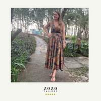 Woman on vacation in the An Bang beach area of Hoi An wears her new custom tailored dress in a silk-mix fabric.
