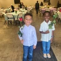 Mother's Day Breakfast hosted by the men, but these two young men presented each mom with a rose Mother's Day Breakfast hosted by the men, but these two young men presented each mom with a rose