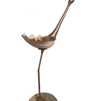 Shell "bénitier" mounted on a crane in the taste of Gabriella Crespi. Shell "bénitier" mounted on a crane in the taste of Gabriella Crespi.