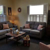 Waiting room at Spark Psychological Services with cool mid-century modern furniture