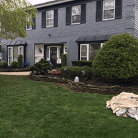 Battleship grey paint services on home exterior Battleship grey paint services on home exterior