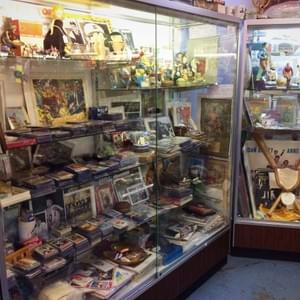 One of many cases filled with collectibles & memorabilia for sports lovers
