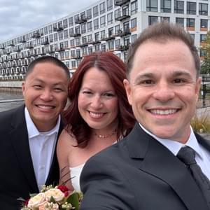 Milwaukee wedding officiant Schwa Potter with couple at downtown waterfront ceremony Milwaukee wedding officiant Schwa Potter with couple at downtown waterfront ceremony