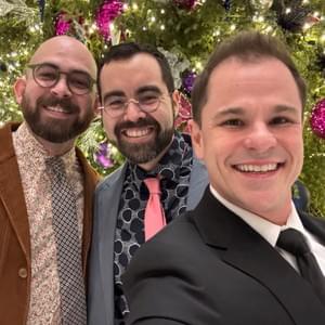 LGBTQ wedding officiant Schwa Potter with grooms at holiday wedding in Wisconsin LGBTQ wedding officiant Schwa Potter with grooms at holiday wedding in Wisconsin
