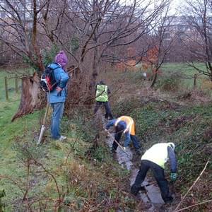 Volunteer group cleaning out ditch Volunteer group cleaning out ditch