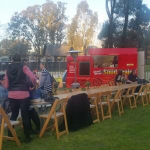 Long Table In front of Wicked Wendy's Spud Train truck. Long Table In front of Wicked Wendy's Spud Train truck.