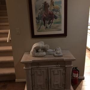 Lou's marble Mother and Child sculpture, shown under one of his early horse watercolors.