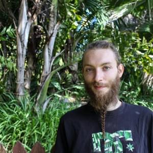 "I burned everything I had in Germany. I burned everything like all the furniture and all the stuff that I owned on a big pile and then I just grab my backpack with my kilograms and went to Australia. I just brought myself up here in Nimbin and I just stayed. I was invited to a community where I was living for nearly one and half years; it’s a self-sustainable community. So, we’re just using rainwater and we’re growing our own veggies and we have couple of chickens to get some eggs, and stuff like that. We’re trying to be self-sufficient completely. And my story is like; I want to step out of the society really. Don’t want to be part of that, like normal. Because for me, it makes no sense, for me, I have to come back to nature. I have to find myself. I have to sort out my problems and I have to go my own little pathway. For me, the normal society is just about rushing and being something and owning something. And like, the more money you have the more you’re accepted in society. So, I am just trying to get out of all that.  I’d like trying to be on myself, to support myself. That’s what I need and I just don’t give a f* about what people think of me or don’t wanna be in a work structure as well. I don’t like to work for the company just to raise their profit. Because I would like to work in a company where everybody is owning the same kind of money, the same amount of money so there is no f*king hierarchy; boss, vice boss and then its like going down and down and down. For me, it should be, everyone, and everybody should earn an equal amount of money when we work for the company together.  Don’t know, its just about that the whole f*king world has been surrounded the capital. I’m not a big fan of that. Especially, because we are producing all the problems of the world, like all the countries that are really well with money like Germany for example in Europe or France, is not too bad as well. But on the other side, you have all that countries where people are really like suffering and you got so many refugees now, like all over the world. And its just like the people are not thinking, okay, let’s do something together to figure out the problem. The people are just like, separating again. They’d like; there’s we and there’s the others. So, I really don’t like that. Because for me, the label ‘refugee’; just the label ‘refugee’ for human being. It’s just wrong because it’s a human like you and me. Its like not a like, I am a refugee; you can say that as well. Like, I was escaping from Germany you know. But only by putting that label on persons you make them different. That’s why people are scared of it because it is a different thing. And it is like not part of me, it’s part of something else. That’s the problem. I think people have to get over that.  I was struggling the most really when I was living in Germany and I just didn’t feel accepted. In my way of thinking, I just felt pushed out and I mean, there are lots of hard moments actually in my life. My mom got cancer for example and I had lot of troubles with the police. They broke my nose, they broke my chin, and they broke my ribs just because I stand up for my right and were just saying my opinion on protests and stuff like that.  We had a little house where all the alternative people were living. It was unoccupied house. It’s like an empty house that we just used for cultural center to give the people the chance and the opportunity to come to our place to be out of that moral structure. And then one night, police just came in and they smashed the whole building. They just beat everybody up who was in that building. We couldn’t do anything. We were like sitting on the ground, with our hands up but the police just didn’t give f*. They just came in and pepper sprayed and directly beat up everybody with their f* truncheons. And I don’t know. It’s just like, you know when you’re trying to be, you tried to do your own thing and you’re not harming anybody. So you’re not like you’re doing anything, which is disturbing anybody else. But there’re still people trying to push you down.  So yeah, for me, the hardest thing is anyway, to accept how the world is running, really. That is my biggest issue, like why the world as it is. Why the people is f* greedy? And why they’re not supportive? Why they’re not like living in solidarity? Why they are not using the potential that we have to create something beautiful? Create something for everybody happy. But people are always on their own ego thing. So, that’s my think. That’s my thinking. That’s my issues. That’s my kind of stories.I’m kinda of hiding here, really. I mean Nimbin is beautiful and I really like it. But in the end, I’m really like hiding. Because there’s nothing else what I am doing here. Just like being here is time stops and you don’t have to think too much about any problems and you can just like live from day to day. But in the end, that is not the solutions as well. You know, it’s not. Because I wanna make some changes as well. It is not happening by just sitting here and smoking some joints. It is pretty much some kind of retreat as well, to calm yourself down and to get some new energy. To use that energy; to use that energy to get out of that with more power afterwards. So, it’s just like… That’s what I’m saying it’s not a place forever. It’s a place where you can have like your retreat, your leave and everything. You’re taking a leave with your time. When you have the power again, you have to use that power to do something else.  When my mother got cancer, I was pretty much with myself all the time trying to suck it all up and didn’t let it out. I am trying to figure it out with myself. I was not talking to anybody. I was not like the guy who is always around my mom. And then I wasn’t talking to people, talking to her and trying to help her. I was just like mainly on myself, just to figure out what I can do but I couldn’t find a way to help because it was really hard for me. But in the end, I just like I figured out that it was not my fault that I was not there. Because there was an issue for me that I had overthinking; I was not there enough for my mom at that time. Eventually, I thought, nah, that’s just a way for me how to deal with it. I couldn’t be there all the time because that would have destroyed me.  I was just trying my best, trying to figure out with myself how I can handle the situation. In the end, it worked well. She fought the cancer. It was quite nice. But it was just heavy experience. It was just like having Christmas and then my mom having no hair and baldhead, looked really sick. In the end, it made me stronger anyway. I’m just following my way actually.  From that experience, I learned that it is not about guilty. There is nothing you have to feel guilty about. Because it doesn’t matter how you react or how you’d like to do or what you are doing in that whole situation like that. It’s just like; your own personality, which is creating that behavior. So, it is not bad to have that kind of behavior. Even if you feel guilty about something, it doesn’t matter because it’s just you. So it makes you as a person. That’s what I found out really. For me, Nimbin is just a place. I can just shut off all that bloody thinking. I’m thinking so much all the time. And see, I just can like shutting it off. I can put a switch and I am not thinking anything. I can’t do that anywhere else in the world. I could never sleep in Europe; I was not able to sleep. Here, I’m sleeping like a baby.  There is so much about that energy. For me, it’s all about energy. The place, which has energy where I can suck up that energy and use it for my self, for my inner body, then it’s definitely the right place for me. So that’s when I felt Nimbin is right. Because I just felt the energy of the area. There is a lot of healing energy here; the sea, and the wind."