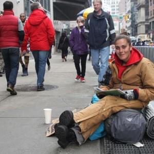 About why you are here, why are you staying here ? « I’ve been on and off for about twenty years now. I’ve been in New York on and off for 3 years. I went back to my hometown in Richmond Virginia for just over a year, where my husband passed away… then I came back up here because I like it here, I have of friends here and I wanna try and get off the street and they are better social systems to help with that here than in Virginia. I wanna go back to school, I wanna get off… first and foremost I wanna get off the street, I wanna get a job. But it is hard to get a job being on the streets because you carry all your stuff around so you have to find somewhere to put it and they won’t let you, you know, even in the back… and then there is this the whole, you know, being able to shower, and wash your clothes but then you know, there are places around the city, all over the city that give you a chance to shower and wash your clothes and do that, but there are limited days that you can do that. But if you go the HRO, the Human Resources Office you know they can put you in a shelters where it’s a lot easier to do those things, they have a lot more programs that you can get in to help you find jobs, they give you food stamps, taxes sytems like it’s a lot more that they do for you here because of the homeless problem here… from what I heard, they’re trying to cut back on to the services they offer to, you know, homeless people… which I don’t find very… I don’t think it’s a good idea cuz you know, because even with the services they offer now there are still a lot of people on the streets… I don’t know if it’s because they want to be or if they just… haven’t tried to go get help or what it is… but to cut back on the funding or anything that they have for that, it’s just gonna make the situation worse than it already is. »