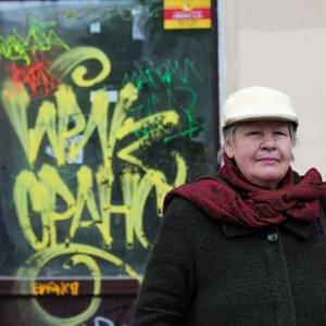 « When I was 19, I went to the university and started to live here. I’m from Ukraine, that’s why I’m so interested about this area, because before my nineteen years, my parents used to live there, I used to leave there… for a long time. My daughter is the fifth generation, who was born in that house. Our house was captured by a local mafia; it was in 2003, right for the 300 birthday of the St Petersburg University. I would like to tell you my story… I met the mafia a second time, they wanted me to sell my apartment, they told me that if I would stay, if I wouldn’t sold the apartment, there will be dangerous consequences. And well I said I will stay and live here. They told me that in that case, I was going to pay. There were renovations to make everywhere, I had money for the renovation but I wasn’t able to pay the mafia. At this moment I was alone with my daughter; my mother is dead, my husband is dead, and we were only two in this three room apartment. If you write about our generation, say we wanted to stay in this house. My husband’s father was journalist, he used to photograph the war, that why I’m so found of literature. We used to have a gorgeous library, his father collected this library. When we started to get pushed out the apartment by the mafia, they used special methods you know… something terrible happened, on the roof, there was a pipe with the hot water and it exploded and my mother was basically boiled up by this hot water. She survived only twenty days after that. She wasn’t able to walk, she broke her legs… and she wasn’t able to do anything. When my husband came into the room, the floor was all covered by hot water and all the books were destroyed, and everything we had was destroyed as well. From this point we started to live from nothing. My mother died and after some time my husband was really sick and he died as well. But after all those things, I stayed alone with my daughter. The mafia had an opportunity, we were defenceless, and nothing could protect us. And now this house… number 23… We had to move out and leave this house. The mafia wanted to build a hotel instead, but finally they didn’t build anything, the house is still here, because inside this mafia group, they were conflicts and they weren’t able to go to the end. I’m so connected to this area, we’ve choose this apartment and started to live here. The library is number 17 and my house is 23. I have two houses now, the library and my home. I don’t go to the theatre because it’s too expensive for me, I rarely go listen to music somewhere, but I can go for free in the church. The rest of the time, I’m listening to the radio, or watch TV, most of the time culture programs.  During USSR time, we had a secret movement, we were working against the government, and our meetings took place in a square. There is this house too, a friend used to live here, we used to meet up here each week and thus I met a lot of people. My first fiancé, George, was studying in the foreign language institute but his mother decided I wasn’t good enough for him so she found a bride for her son. He was also studying at the French department, he was young, he was teaching me French, how to pronounce French… It’s my entire world you know, when it’s about French, it was always my dream. And my first dream flew away when we broke up with George… Now he lives in Moscow, and I gave a mission to my daughter: to search for him in Moscow. And she found him. He is still living at the same address, and I wonder… I have only one question for him, but it is probably too late to ask… But I still curious about it, I want to ask “ how could you do that to me, accept what your mother did, we had such a good relationship, even if it was compromised, and was it your point of view about your mother’s decision? “. She pushed him to act with me like this because of her money; you know so he won’t marry me, she said “If you marry her now, you won’t get material support from me anymore”. I never heard anything from him after that. His mother called me, and told me the usual mother’s speech, that we weren’t ready to get married. You bet we were! We had all the papers, and a home address, and the rings, and everything was going straight to the wedding, planned for the 26th of April… It’s the blackest day for me. We were going to get married but his mother called me on the phone to tell me he won’t come… I decided not to talk to him, because he’s the one supposed to call me, but he never did, he never asked me how I was feeling after that. When I came to Moscow, on the 28th of April, so I could look at him in the eyes, I was destroyed and it was the first catastrophe of my life. But my love for France and for the French language never disappeared. We broke up but I started learning French, of course, and every time, when something was connected to France (music, cinema, art…) everything was precious for me. There can’t be another way, he was a dream, ok, but France is still a certain part of my dream. Everything is interesting and everything went away, but I’m happy to still be able to remember and tell things, because a person dies when the memory die. Now life goes on, and I’m still able to meet beautiful young people who take the time to listen to me and for some reasons, are interested about my story, the story of a crazy old women… Thank you, really. » « When I was 19, I went to the university and started to live here. I’m from Ukraine, that’s why I’m so interested about this area, because before my nineteen years, my parents used to live there, I used to leave there… for a long time. My daughter is the fifth generation, who was born in that house. Our house was captured by a local mafia; it was in 2003, right for the 300 birthday of the St Petersburg University. I would like to tell you my story… I met the mafia a second time, they wanted me to sell my apartment, they told me that if I would stay, if I wouldn’t sold the apartment, there will be dangerous consequences. And well I said I will stay and live here. They told me that in that case, I was going to pay. There were renovations to make everywhere, I had money for the renovation but I wasn’t able to pay the mafia. At this moment I was alone with my daughter; my mother is dead, my husband is dead, and we were only two in this three room apartment. If you write about our generation, say we wanted to stay in this house. My husband’s father was journalist, he used to photograph the war, that why I’m so found of literature. We used to have a gorgeous library, his father collected this library. When we started to get pushed out the apartment by the mafia, they used special methods you know… something terrible happened, on the roof, there was a pipe with the hot water and it exploded and my mother was basically boiled up by this hot water. She survived only twenty days after that. She wasn’t able to walk, she broke her legs… and she wasn’t able to do anything. When my husband came into the room, the floor was all covered by hot water and all the books were destroyed, and everything we had was destroyed as well. From this point we started to live from nothing. My mother died and after some time my husband was really sick and he died as well. But after all those things, I stayed alone with my daughter. The mafia had an opportunity, we were defenceless, and nothing could protect us. And now this house… number 23… We had to move out and leave this house. The mafia wanted to build a hotel instead, but finally they didn’t build anything, the house is still here, because inside this mafia group, they were conflicts and they weren’t able to go to the end. I’m so connected to this area, we’ve choose this apartment and started to live here. The library is number 17 and my house is 23. I have two houses now, the library and my home. I don’t go to the theatre because it’s too expensive for me, I rarely go listen to music somewhere, but I can go for free in the church. The rest of the time, I’m listening to the radio, or watch TV, most of the time culture programs.  During USSR time, we had a secret movement, we were working against the government, and our meetings took place in a square. There is this house too, a friend used to live here, we used to meet up here each week and thus I met a lot of people. My first fiancé, George, was studying in the foreign language institute but his mother decided I wasn’t good enough for him so she found a bride for her son. He was also studying at the French department, he was young, he was teaching me French, how to pronounce French… It’s my entire world you know, when it’s about French, it was always my dream. And my first dream flew away when we broke up with George… Now he lives in Moscow, and I gave a mission to my daughter: to search for him in Moscow. And she found him. He is still living at the same address, and I wonder… I have only one question for him, but it is probably too late to ask… But I still curious about it, I want to ask “ how could you do that to me, accept what your mother did, we had such a good relationship, even if it was compromised, and was it your point of view about your mother’s decision? “. She pushed him to act with me like this because of her money; you know so he won’t marry me, she said “If you marry her now, you won’t get material support from me anymore”. I never heard anything from him after that. His mother called me, and told me the usual mother’s speech, that we weren’t ready to get married. You bet we were! We had all the papers, and a home address, and the rings, and everything was going straight to the wedding, planned for the 26th of April… It’s the blackest day for me. We were going to get married but his mother called me on the phone to tell me he won’t come… I decided not to talk to him, because he’s the one supposed to call me, but he never did, he never asked me how I was feeling after that. When I came to Moscow, on the 28th of April, so I could look at him in the eyes, I was destroyed and it was the first catastrophe of my life. But my love for France and for the French language never disappeared. We broke up but I started learning French, of course, and every time, when something was connected to France (music, cinema, art…) everything was precious for me. There can’t be another way, he was a dream, ok, but France is still a certain part of my dream. Everything is interesting and everything went away, but I’m happy to still be able to remember and tell things, because a person dies when the memory die. Now life goes on, and I’m still able to meet beautiful young people who take the time to listen to me and for some reasons, are interested about my story, the story of a crazy old women… Thank you, really. »