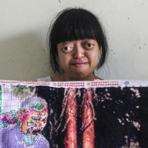 "She can’t speak because she is an orange agent children. She do her best everyday to improve her life even if she have nothing, she try to be like everybody else. You see in her hands? She sews this picture for months now." "She can’t speak because she is an orange agent children. She do her best everyday to improve her life even if she have nothing, she try to be like everybody else. You see in her hands? She sews this picture for months now."