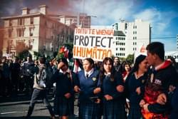 Young people linked in arms at an Ihumaatao solidarity action Young people linked in arms at an Ihumaatao solidarity action