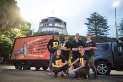 The ActionStation crew and our billboard calling for sexual health to be fully funded The ActionStation crew and our billboard calling for sexual health to be fully funded