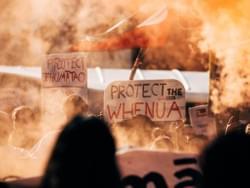 Signs at the Ihmaatao solidarity action that say "protect Ihumaatao" and "protect the whenua Signs at the Ihmaatao solidarity action that say "protect Ihumaatao" and "protect the whenua
