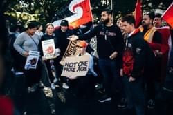 Supporters at the Ihumaatao solidarity action with the tino rangatiratanga flag and a sign that reads "not one more acre" Supporters at the Ihumaatao solidarity action with the tino rangatiratanga flag and a sign that reads "not one more acre"