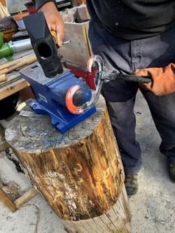 Forging a horseshoe Forging a horseshoe