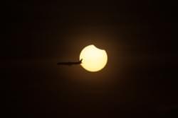 Plane Crosses Solar Eclipse Plane Crosses Solar Eclipse