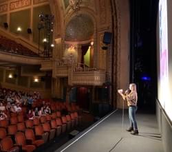 Artistic Director Stephanie Patrick presenting "Milez" at Paramount Theatre, July 2022.