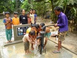 A grateful Cambodian family enjoying fresh water from a well installed by the Mark & Trina Ramsey Foundation in celebration of Trina & Lisa's father's 83rd birthday A grateful Cambodian family enjoying fresh water from a well installed by the Mark & Trina Ramsey Foundation in celebration of Trina & Lisa's father's 83rd birthday