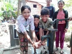 The family of Pieng Oinng  & Tub Thom enjoying water from the well in Cambodia installed by MTRF in celebration of Dave & Nancy Hoke's anniversary The family of Pieng Oinng  & Tub Thom enjoying water from the well in Cambodia installed by MTRF in celebration of Dave & Nancy Hoke's anniversary