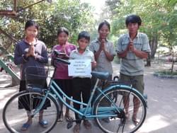 Bike donated by the Mark & Trina Ramsey Foundation so that the Cambodian children pictured can attend school Bike donated by the Mark & Trina Ramsey Foundation so that the Cambodian children pictured can attend school