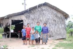 A MTRF water well recipient family depicted in front of their family home in Cambodia A MTRF water well recipient family depicted in front of their family home in Cambodia