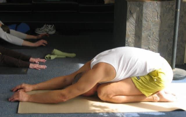 Friend in child's pose Friend in child's pose