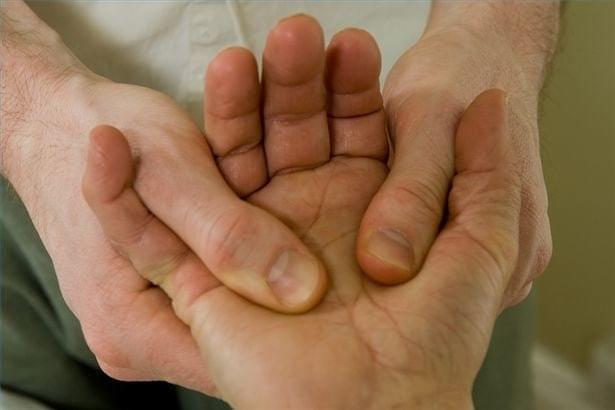 Treating man's hand Treating man's hand