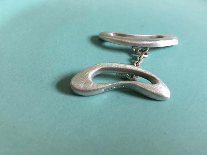 KatrKatrina Alexander Infinity Silver Signature Serene cufflinksin a unique organic sculptural shape with tactile edges KatrKatrina Alexander Infinity Silver Signature Serene cufflinksin a unique organic sculptural shape with tactile edges