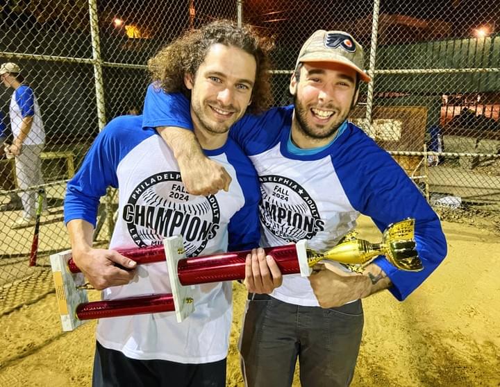 a runner sliding into 2nd base and the short stop throwing the ball after getting an out. a runner sliding into 2nd base and the short stop throwing the ball after getting an out.