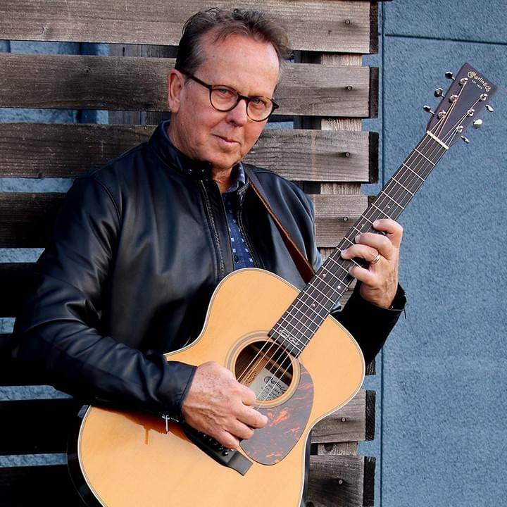 Steve Thompson with acoustic guitar Steve Thompson with acoustic guitar