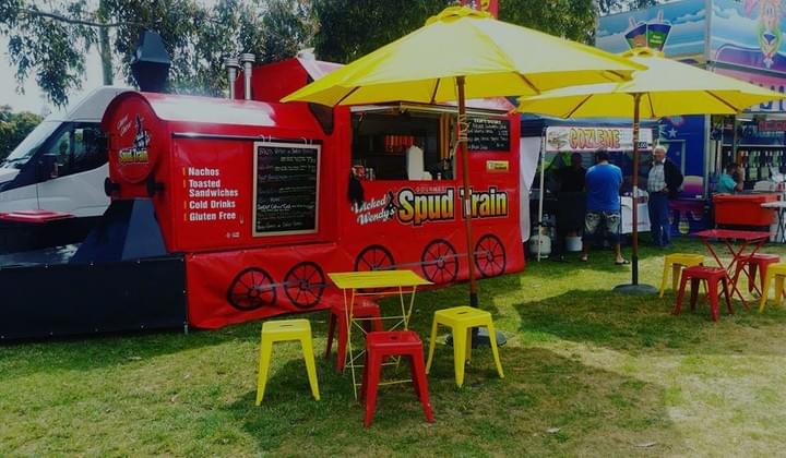 A picture of Wicked Wendy's Spud Train Food Truck on a Festival Event. A picture of Wicked Wendy's Spud Train Food Truck on a Festival Event.