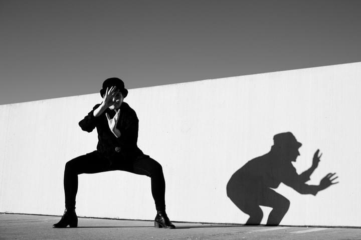 Martha Connerton NCDF black and white modern dance photograph in a parking deck with shadows on the wall  Martha Connerton NCDF black and white modern dance photograph in a parking deck with shadows on the wall