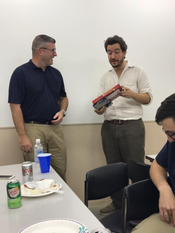 Two men have an informal conversation over refreshments at a seminar Two men have an informal conversation over refreshments at a seminar
