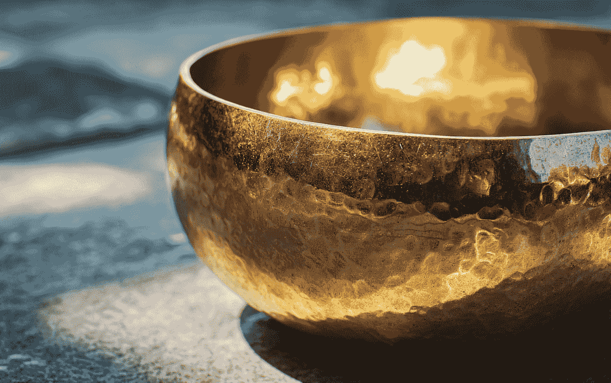 Golden sound bowl with reflective light for sound healing therapy Golden sound bowl with reflective light for sound healing therapy