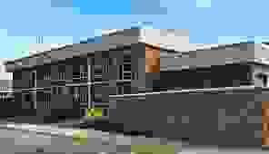 Brick building and monument wall with Union Pines High School signage Brick building and monument wall with Union Pines High School signage