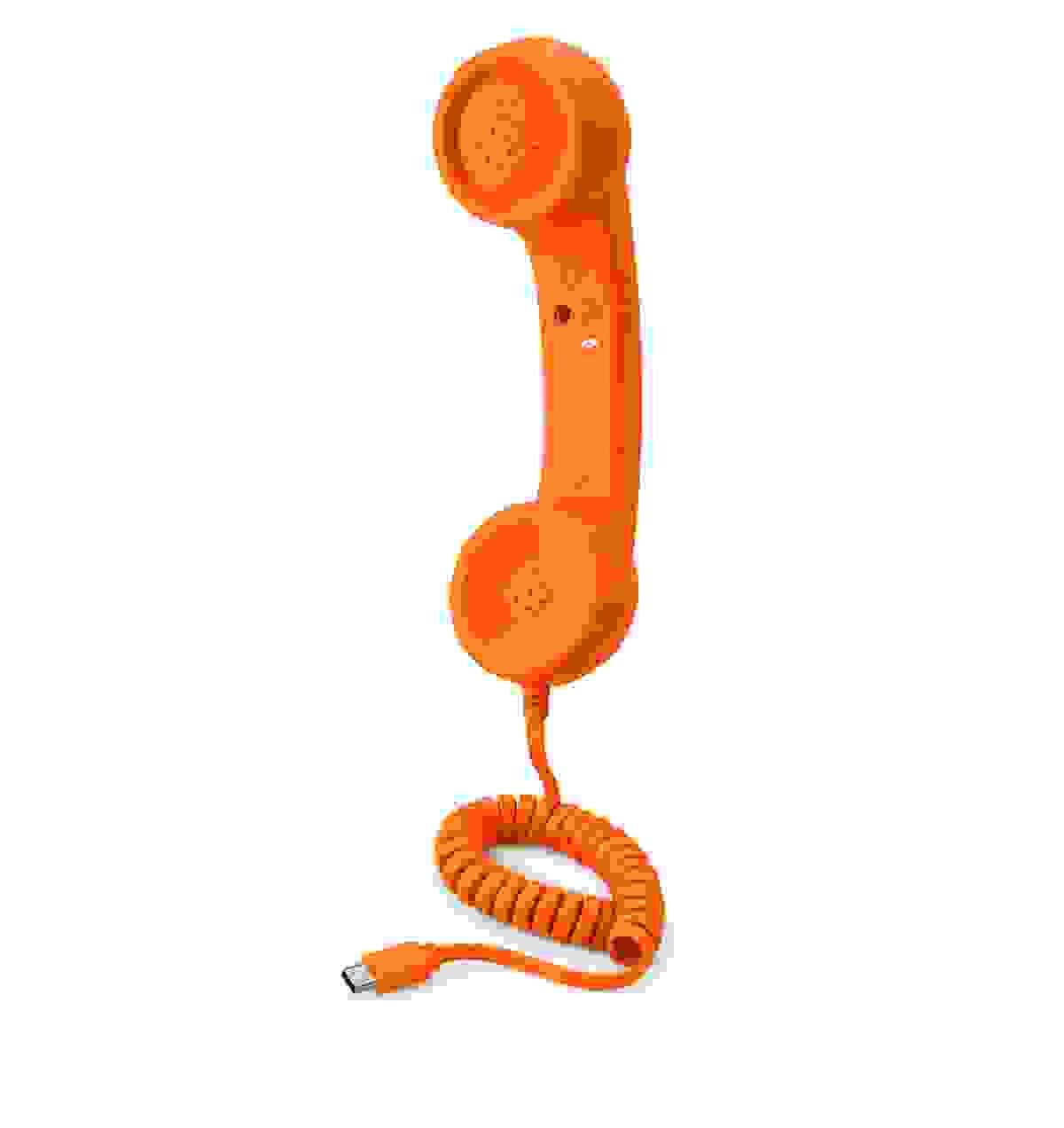Wholesale buyer using a retro phone handset in an office, representing NEW POWER TECH OEM ODM support, product quality and B2B customer service. Wholesale buyer using a retro phone handset in an office, representing NEW POWER TECH OEM ODM support, product quality and B2B customer service.